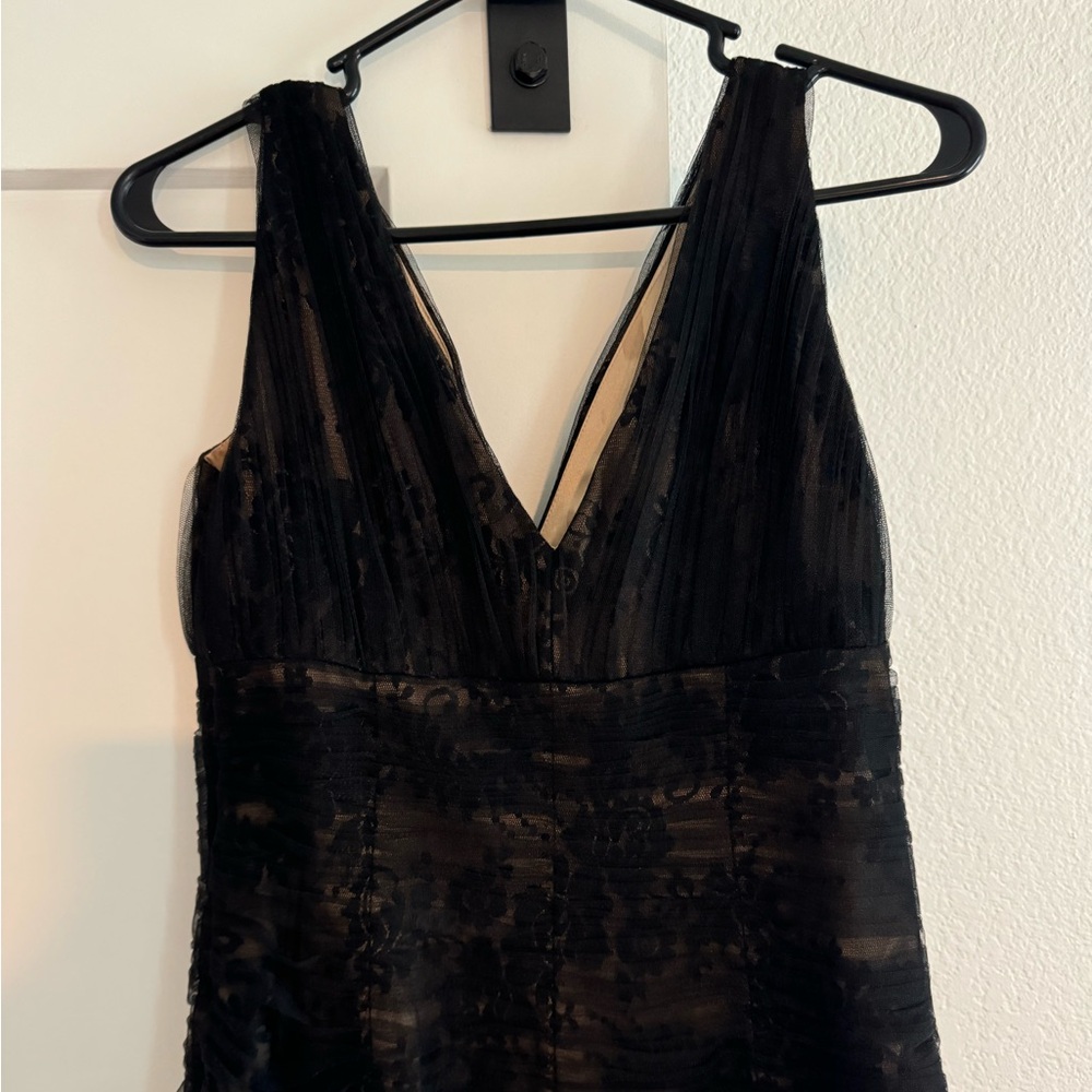 Black tool lace dress with gold lining.ordered in as a size 10 - altered size 6